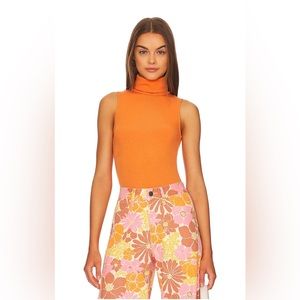 Show me your mumu turtle body suit in burnt Orange size medium - like new